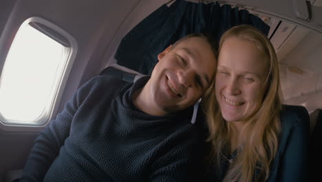 young loving couple in the plane