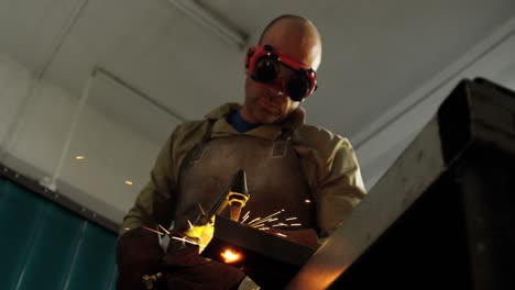 welder welding a metal