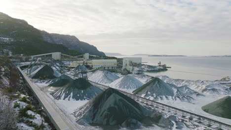 Mounds-Of-Gravel-In-A-Quarry-Site-In-Jelsa,-Norway---aerial-shot