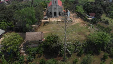 Reveal shot of Gi&aacute;o Xứ Bạch Xa church at Vietnam, aerial
