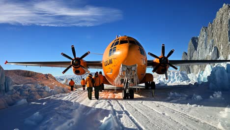 aircraft preparing for takeoff amidst icy landscape in antarctica