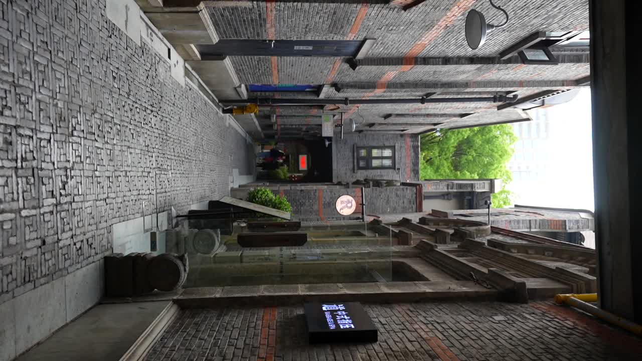 Longtang bricked alley with Shikumen stores and restaurants in Xintiandi neighbourhood, Shanghai, China. Vertical