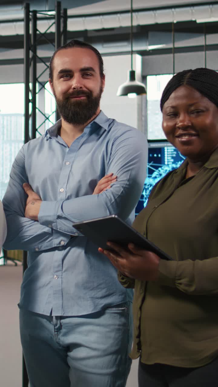 Vertical video Portrait of teamworking engineers writing code, developing machine learning APIs