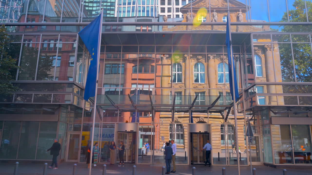 Frankfurt, Germany - November 13, 2022: People at the entrance of the Eurotower skyscraper