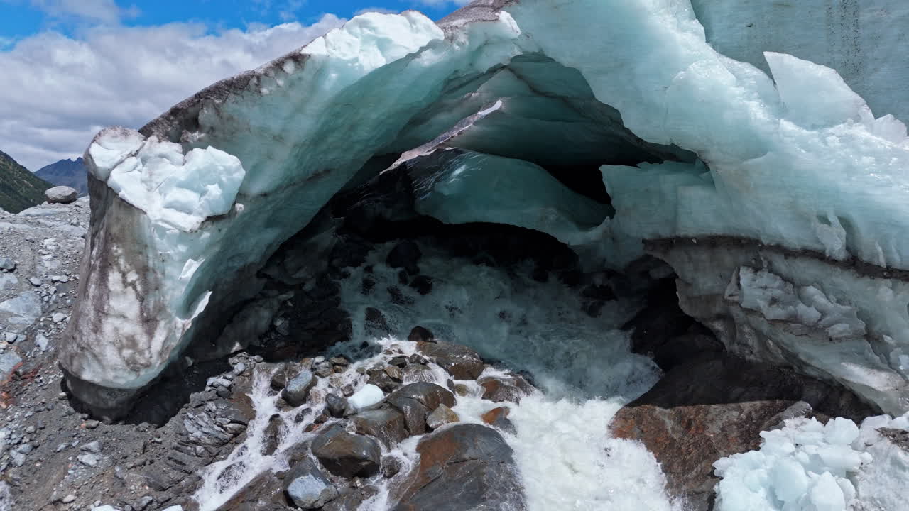 Aerial view of the Morteratsch Glacier's icy landscape and rugged terrain