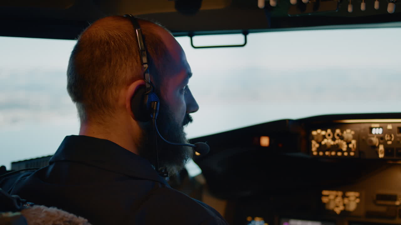 Male captain piloting airplane with engine throttle and power switch