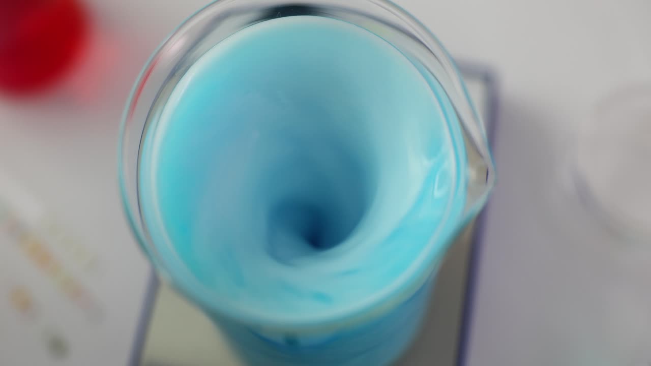 Blue Liquid Stirring in a Beaker