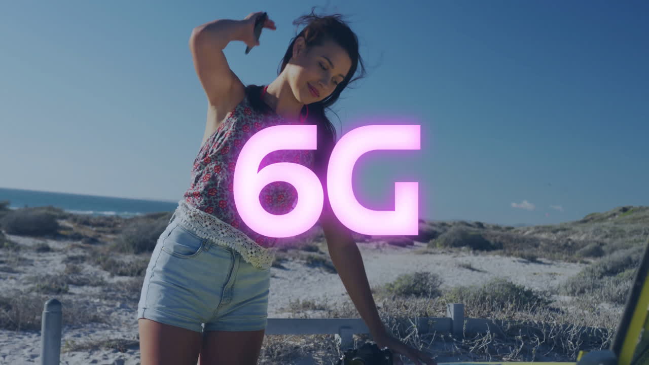 At beach, woman with glowing 6G animation overlay, relaxing by sea