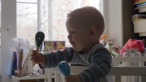 cute baby girl in a round crib 8