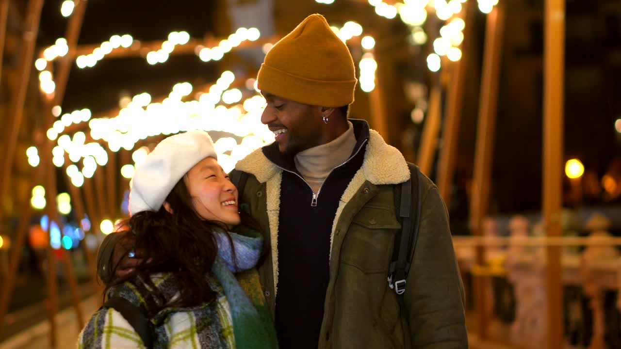 Romantic couple in city at night
