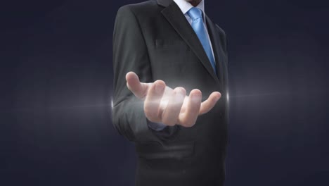 animation of glowing spot of light over businessman hand on grey background