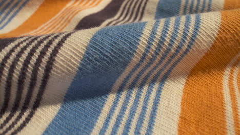 Close-up-slide-over-striped,-cotton-fabric