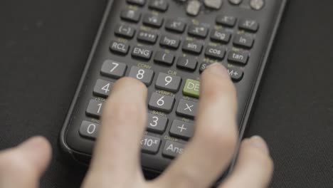 scientific calculator in slow motion: closeup numeric button input