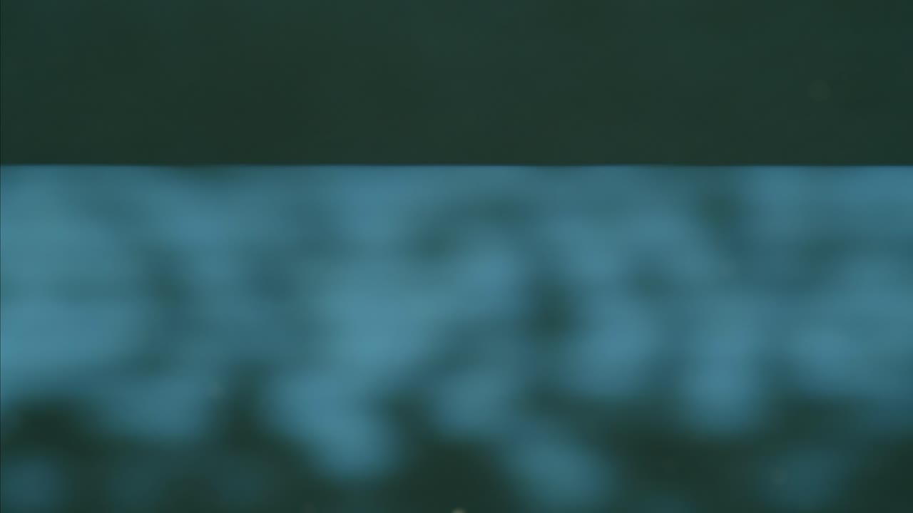 Old vintage tv television grain, vhs effect, Create a unique design with a blue noise pattern of blurred horizontal lines for a modern aesthetic