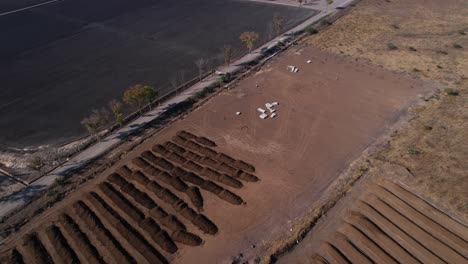 Aerial-pull-up-of-large-plot-of-compost-farm-land-in-mexico