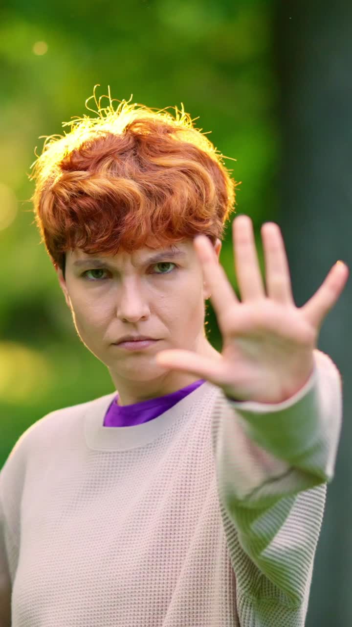 Woman making a stop gesture with her hand