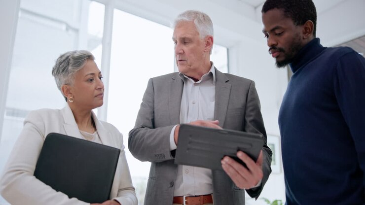 Planning, mentor and tablet with business people
