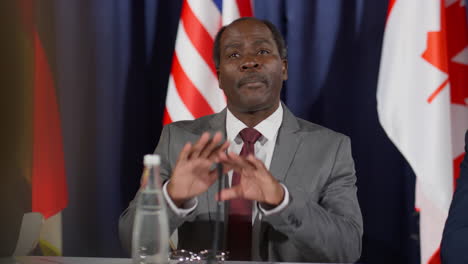 african american leader speaking with journalist at press conference
