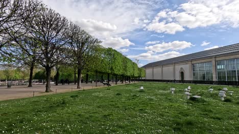 panoramic view of a park with a modern building