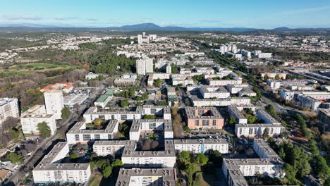 Soaring-over-la-Mosson-on-a-bright-day,-the-heart-of-Montpellier-comes-alive-fro