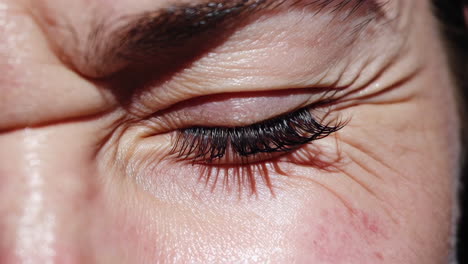 close-up of a woman's face with a strained expression
