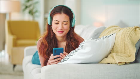 Relax,-music-and-phone-with-woman-in-living-room