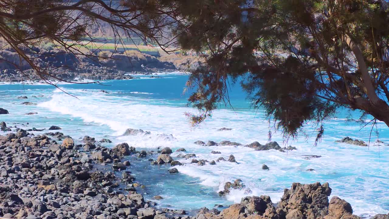 Stunning ocean view in Tenerife with rocky coast and waves crashing