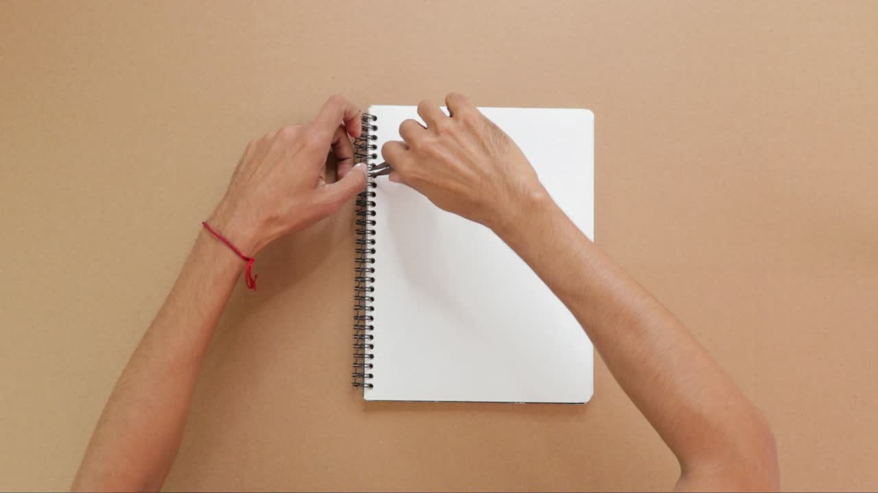 Making a notebook by hand, spiral binding with pliers