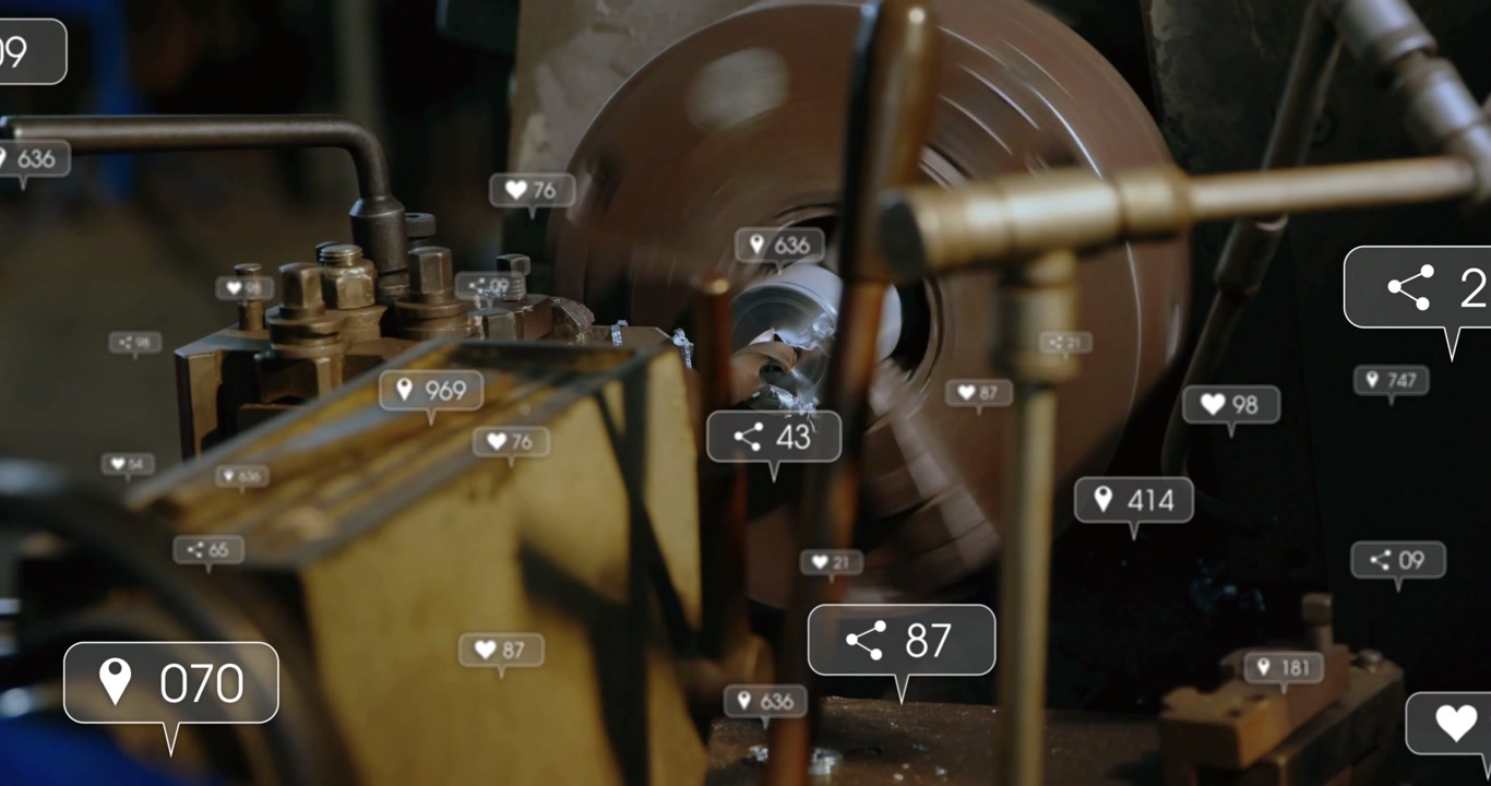 Operator using lathe, tool cutting, chips flying, social icons growing over operator for production