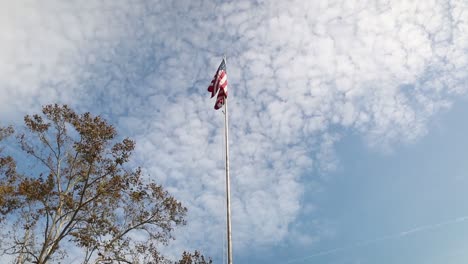 american flag with a blue sky. 120p slow motion footage.