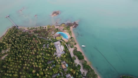 tropical-island-beach-in-thailand's-turquoise-Andaman-sea-during-sunset,-aerial