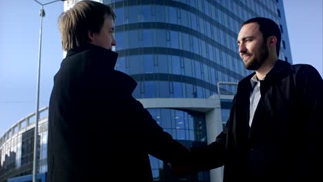 two business professionals having a meeting outside