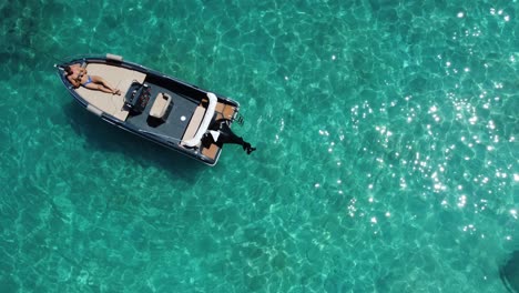 rubber-dinghy-parked-in-the-middle-of-the-Mediterranean-Sea-in-Greece,-Skiathos