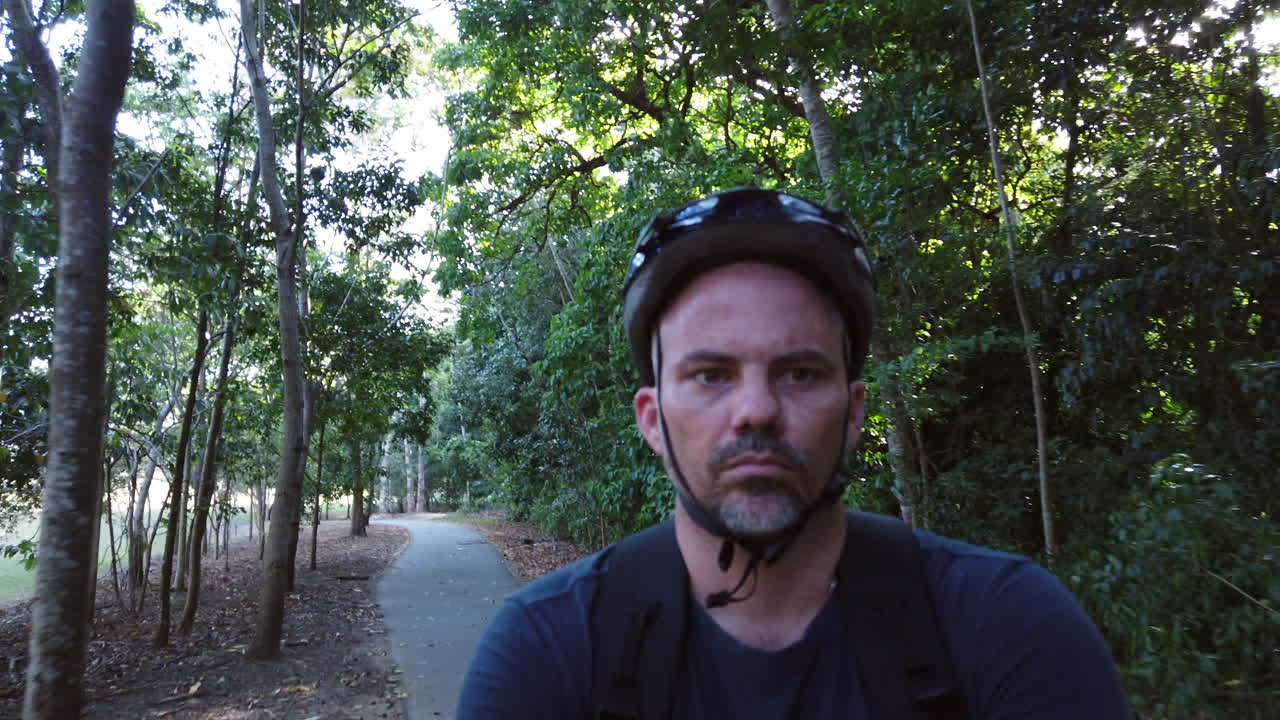 guy riding bike on a footpath slow motion  close up b