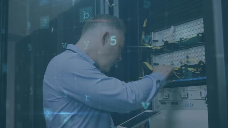 Man working on computer server while warning messages appear in foreground