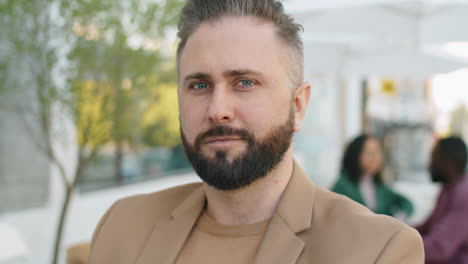 portrait of caucasian businessman in outdoor cafe