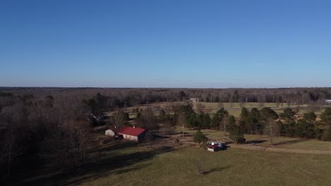 drone flies over barn at a farm