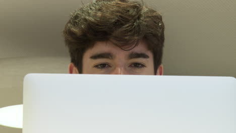 young person working on a laptop