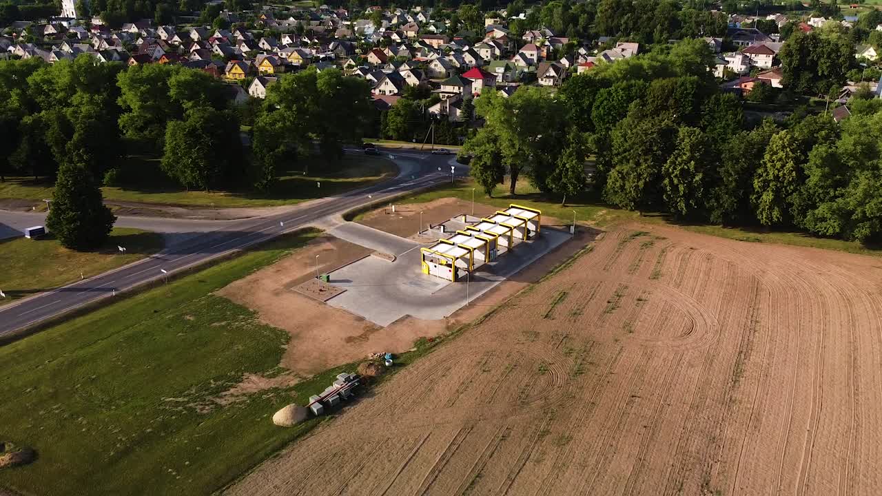 Carwash near small town in Lithuania, aerial drone orbit view