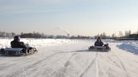 people go-karting on ice in winter