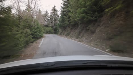 pov driving through mountain pass with narrow road in greece