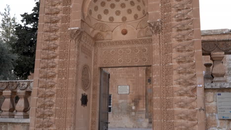 main entrance of mardin latifiye mosque's garden on a cloudy day