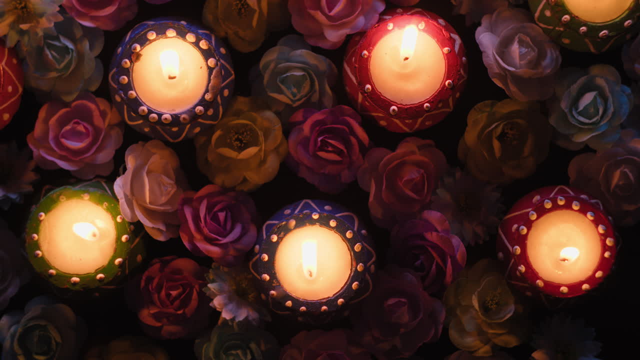 Diwali candles and flowers at night rotating overhead