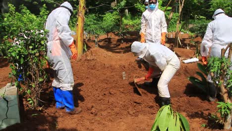 the funeral process of a corpse infected with the corona virus with the covid-19 protocol,