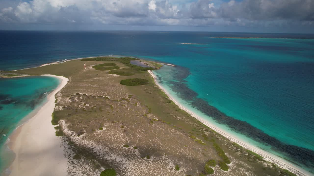 Tropical island with turquoise waters and sandy beaches in los roques, aerial view