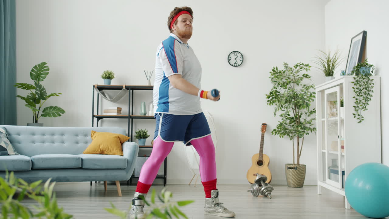 Funny Man Working Out at Home with Dumbbells and a Banana