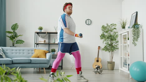 funny man working out at home with dumbbells and a banana