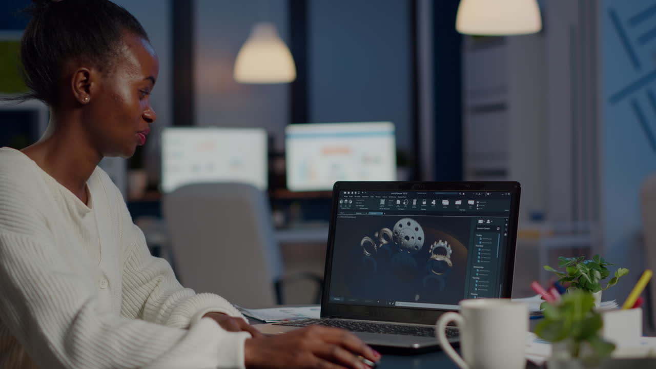 Excited black woman industry architect working on modern cad program