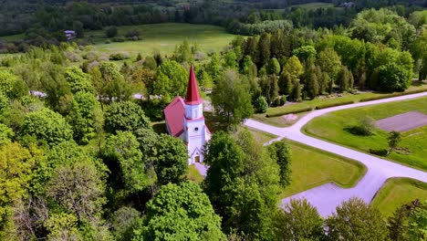 facade and tower of lutheran church in village of skujene in latvia