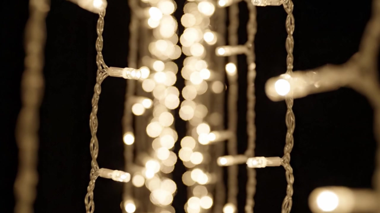 A Mesmerizing Display of Twinkling Lights: Enchanting Strings of Radiant Illumination Create a Captivating Atmosphere That Transforms Any Space Into a Magical Oasis